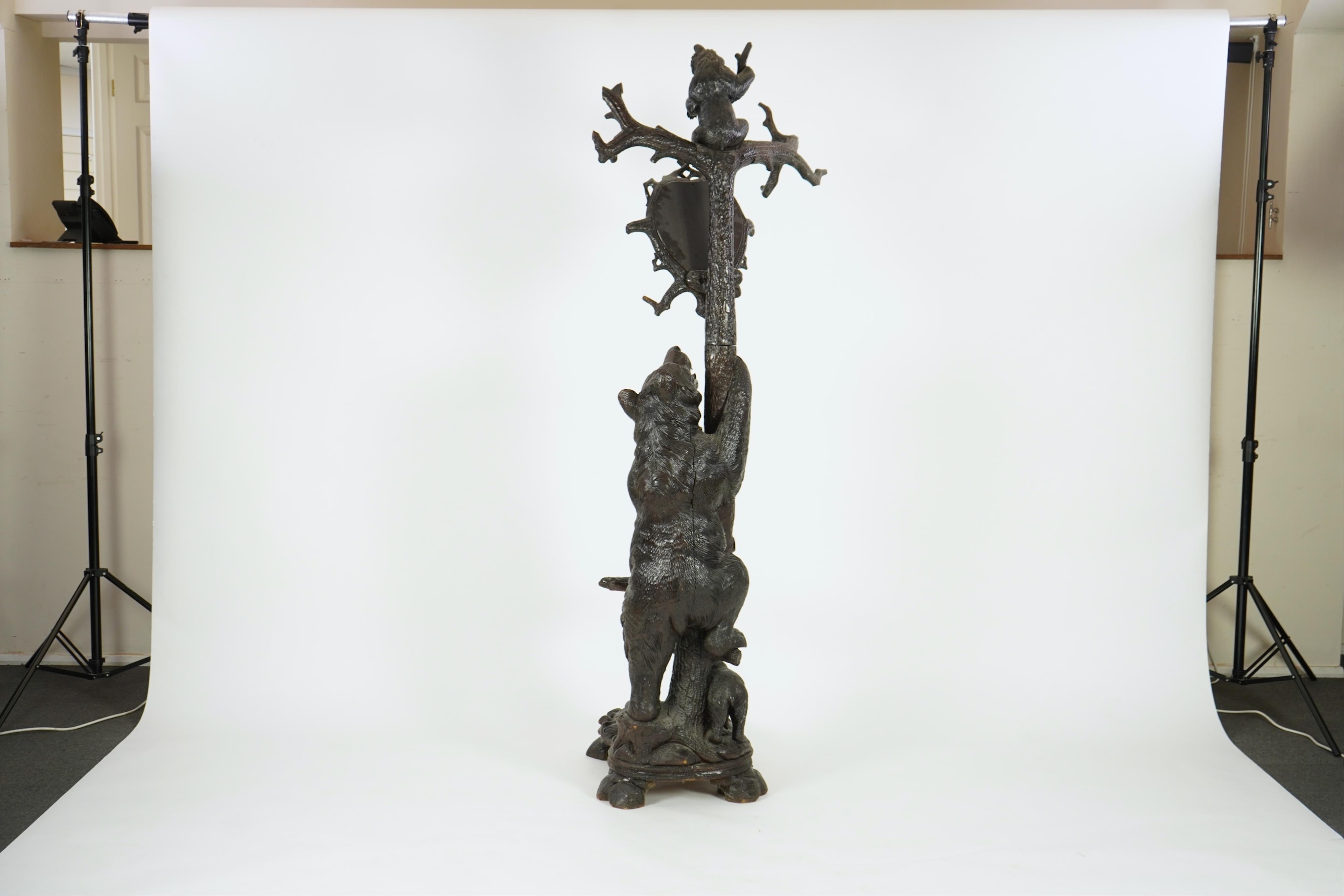 A late 19th century Black forest carved bear hallstand